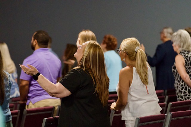 People worshiping together at The Faith Center