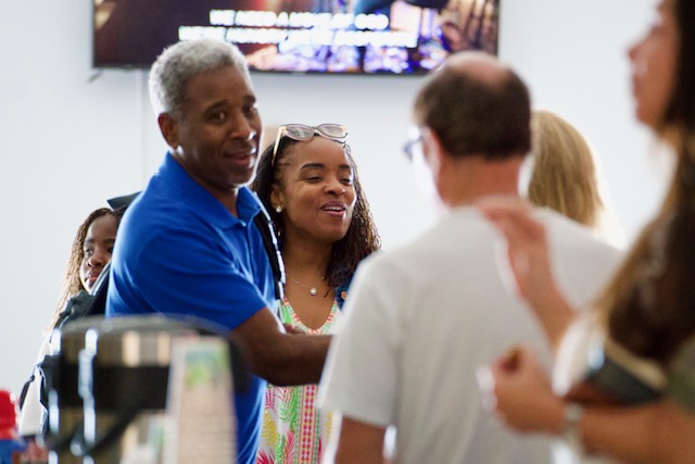 People connecting after a Faith Center service